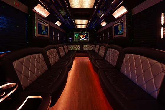 party bus interior with TV screens